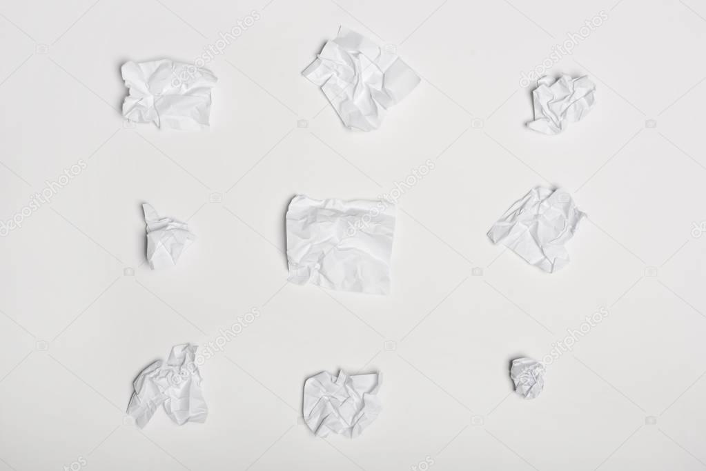 crumpled white note papers 