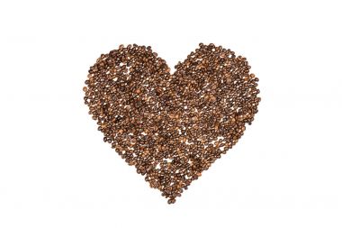 Heart symbol made from coffee seeds clipart