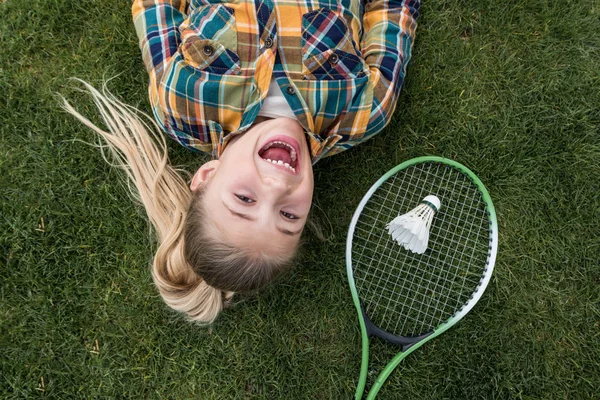 Excited girl with badminton equipment — Stock Photo, Image