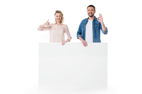 Couple holding blank banner 