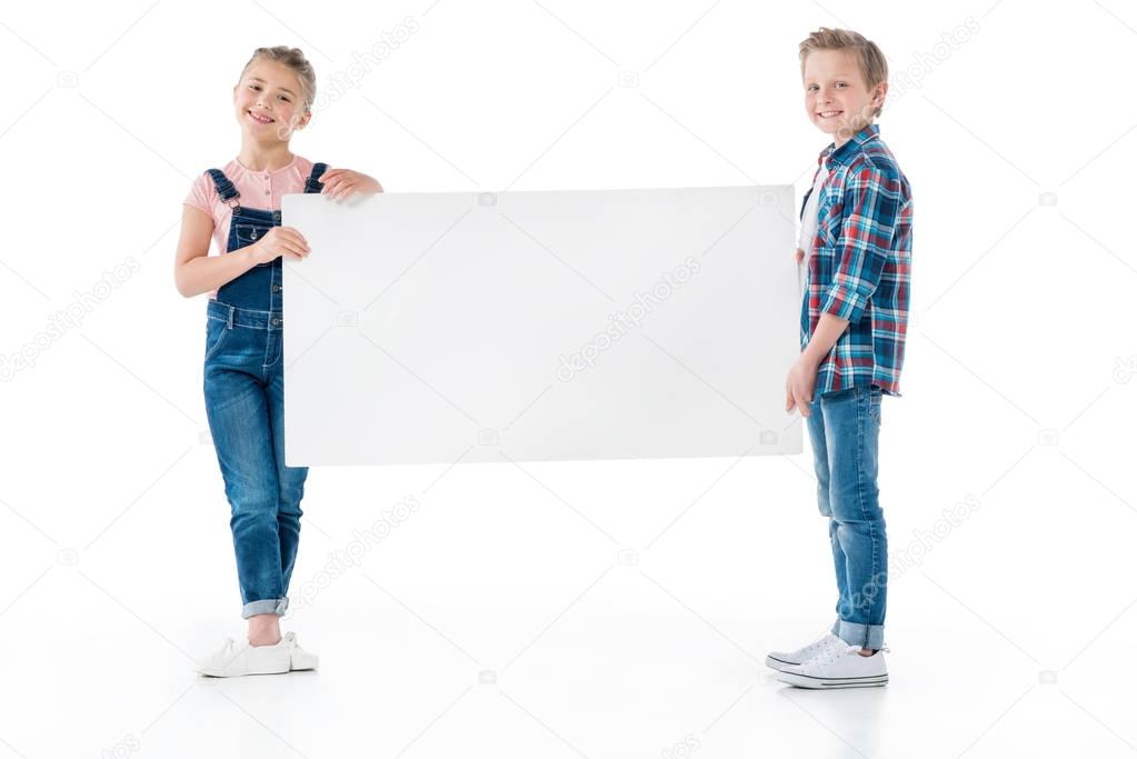 Cute kids with blank banner 