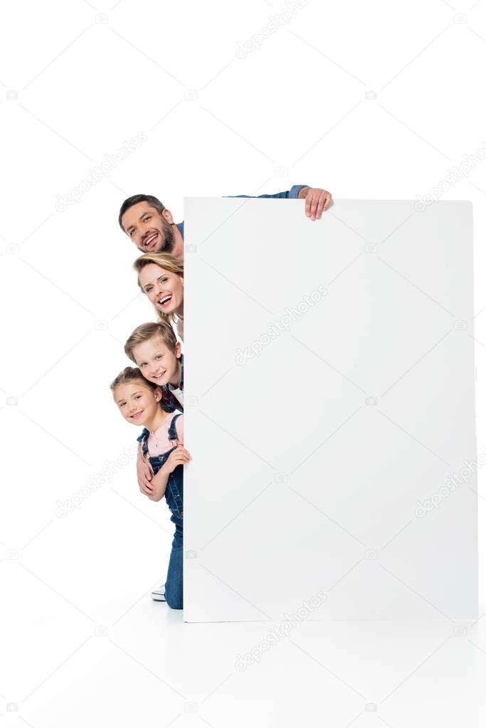 family holding blank banner