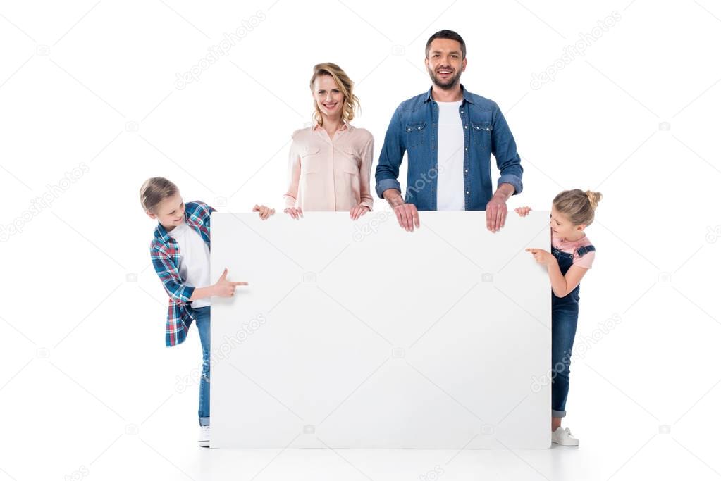 family holding blank banner