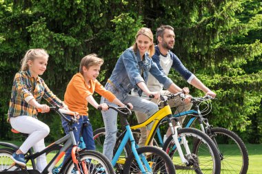 family riding bicycles clipart