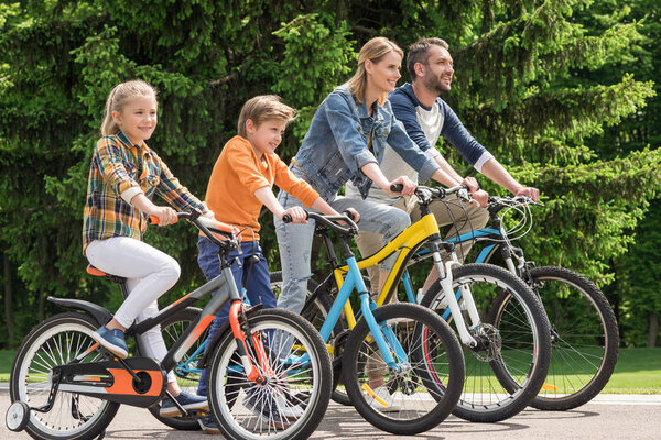 family riding bicycles