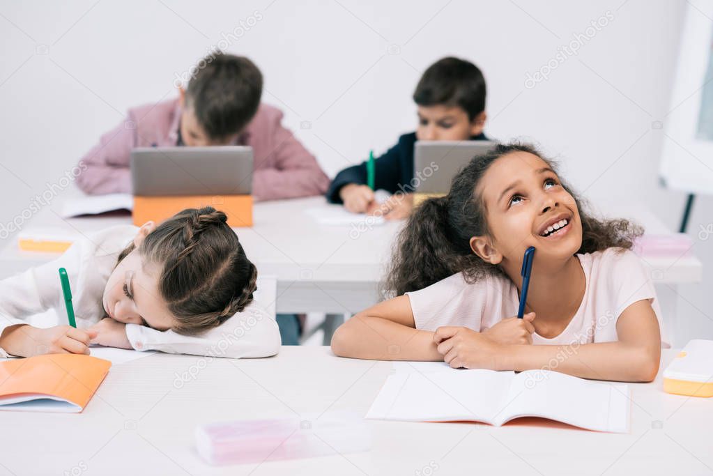 multiethnic schoolkids in classroom