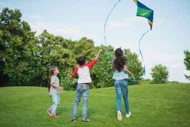 Children playing with kite clipart