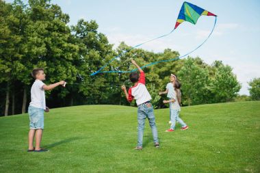 Children playing with kite clipart
