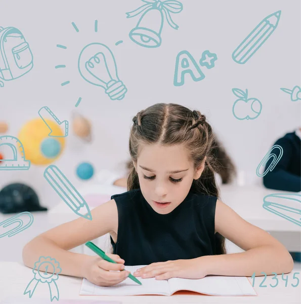 Schoolgirl studying in classroom — Stock Photo, Image