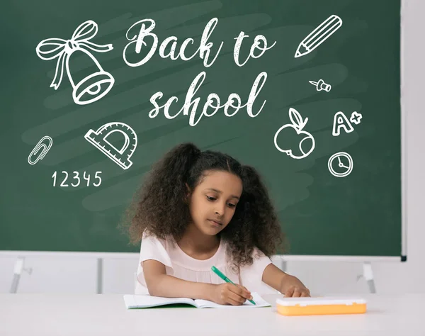 African american schoolgirl studying — Stock Photo, Image