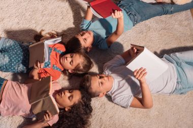 multiethnic children reading books clipart