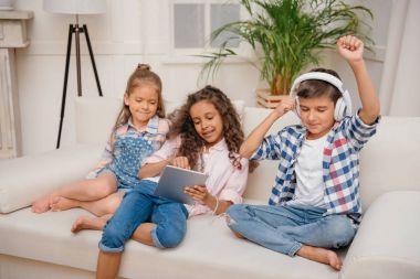 kids with digital devices at home clipart