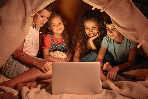 Multicultural kids watching film — Stock Photo, Image