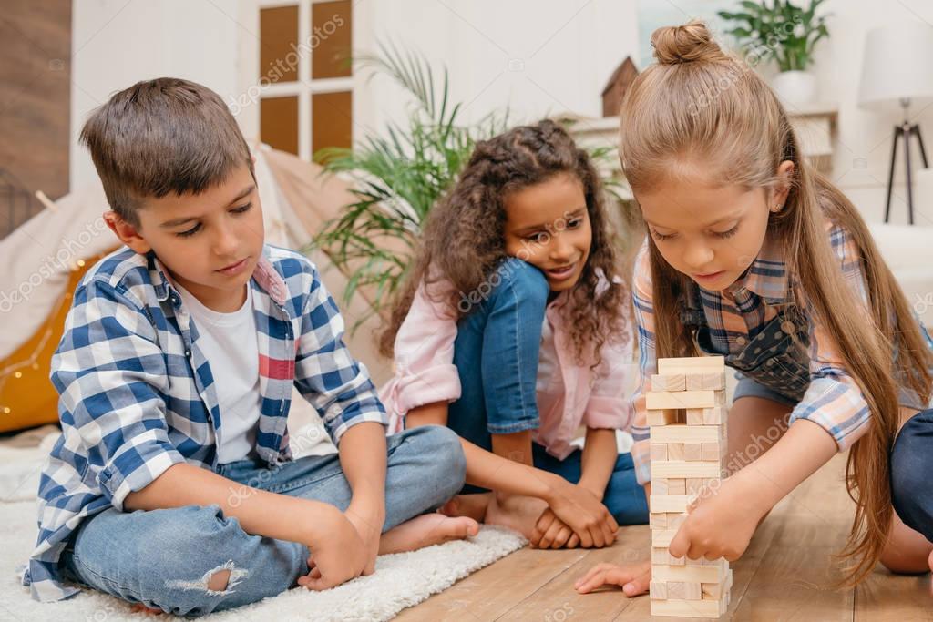 Children playing blocks wood game — Stock Photo © alebloshka #160060482