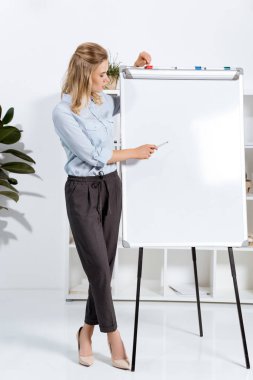 businesswoman pointing at white board clipart