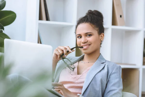 African american businesswoman with laptop — Stock Photo, Image