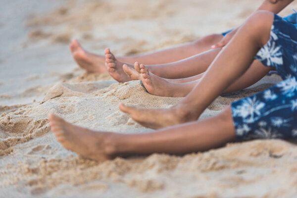 children lying on beach
