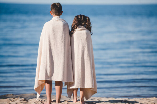 boy and girl on seashore