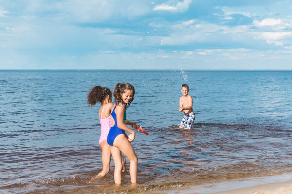 children playing at seaside