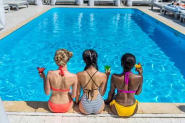 multiethnic women near swimming pool clipart