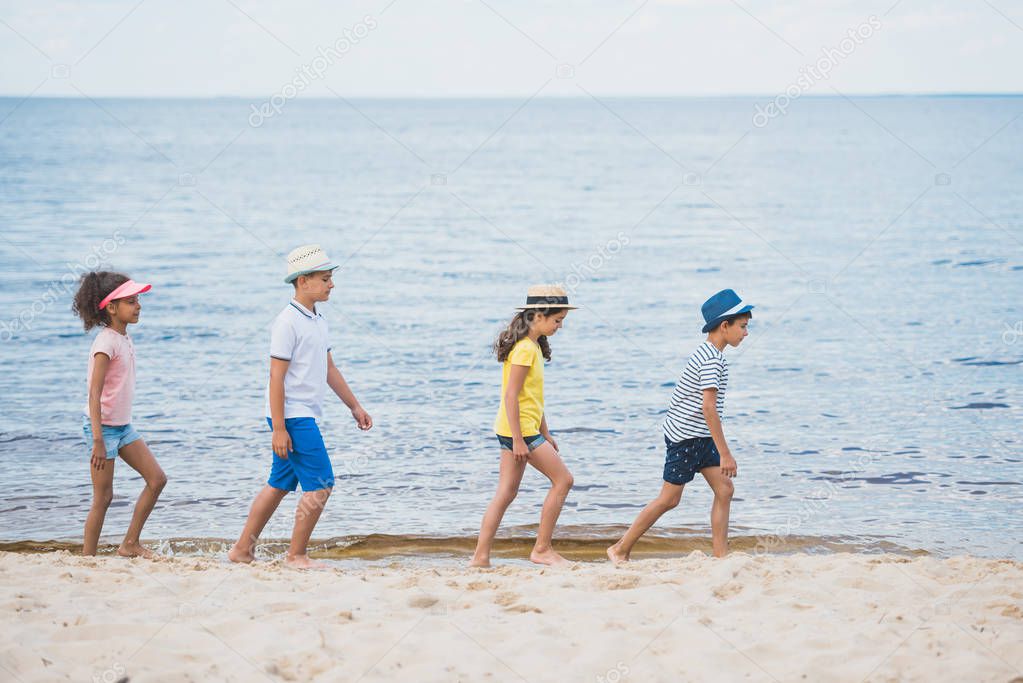 Multicultural kids walking on beach — Stock Photo © alebloshka #160970464