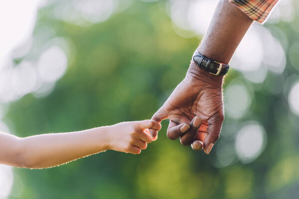 grandfather and granddaughter holding hands 