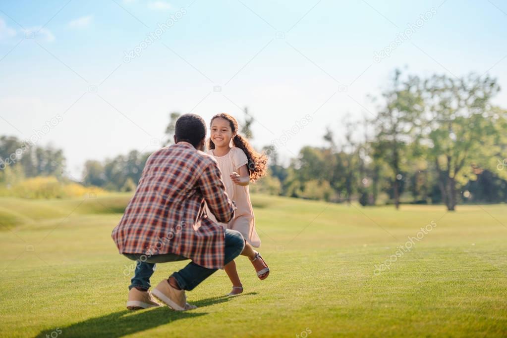 granddaughter running to grandfather