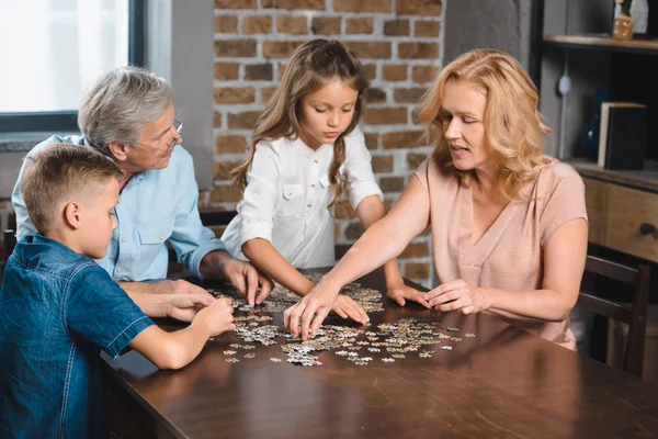 Family playing with puzzle