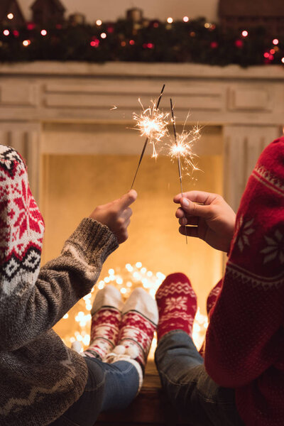 couple holding sparklers 