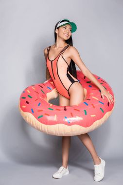 woman in swimsuit wearing pool float clipart