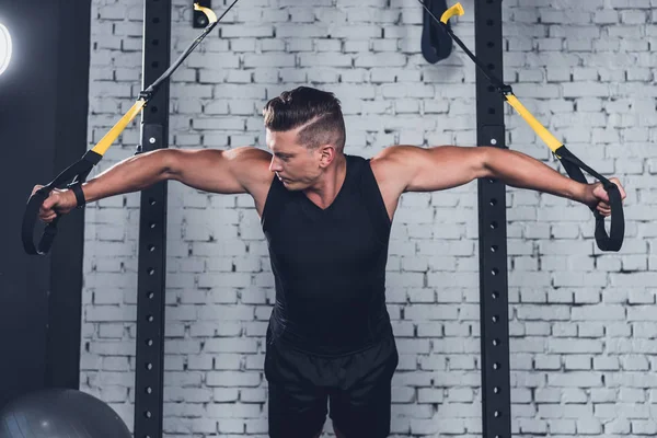 Man exercising with resistance bands