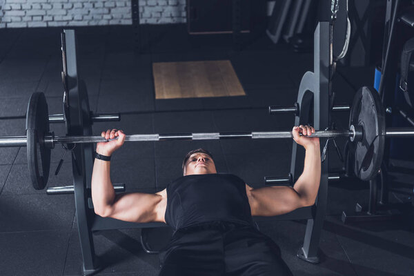 man lifting barbell