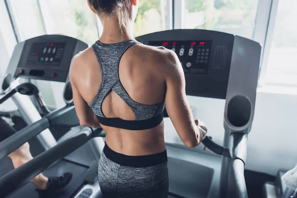 Woman exercising on treadmill — Stock Photo, Image
