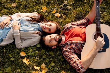 Couple lying on grass clipart