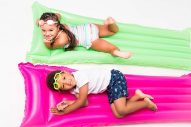 kids in swimwear on swimming mattresses   clipart