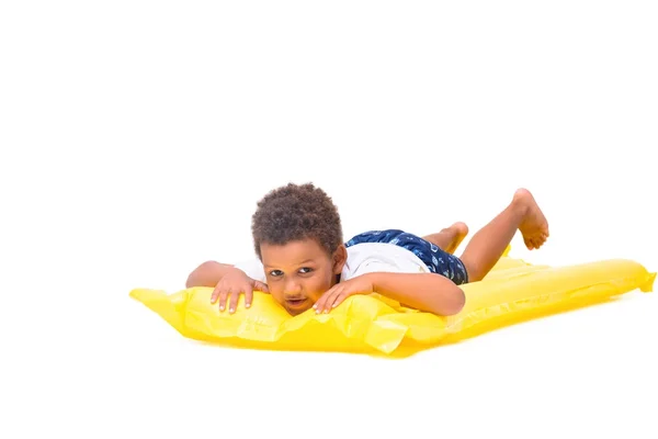 African american boy on swimming mattress — Stock Photo, Image