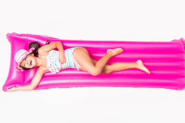 Child lying on swimming mattress — Stock Photo, Image