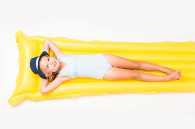 child lying on swimming mattress clipart