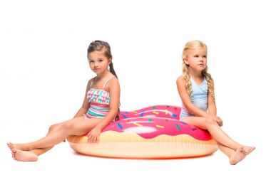kids sitting on swim tube clipart
