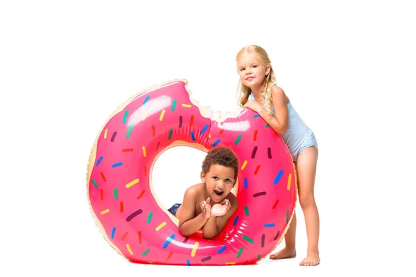 Multiethnic kids with swim tube — Stock Photo, Image