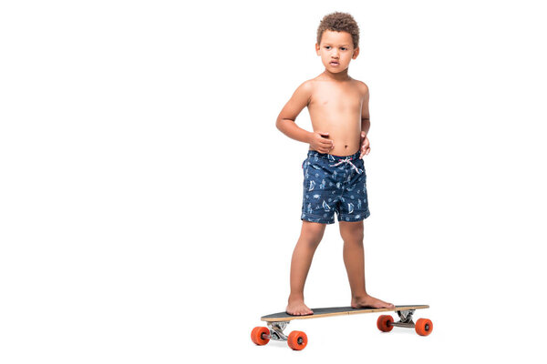 african american kid on longboard 