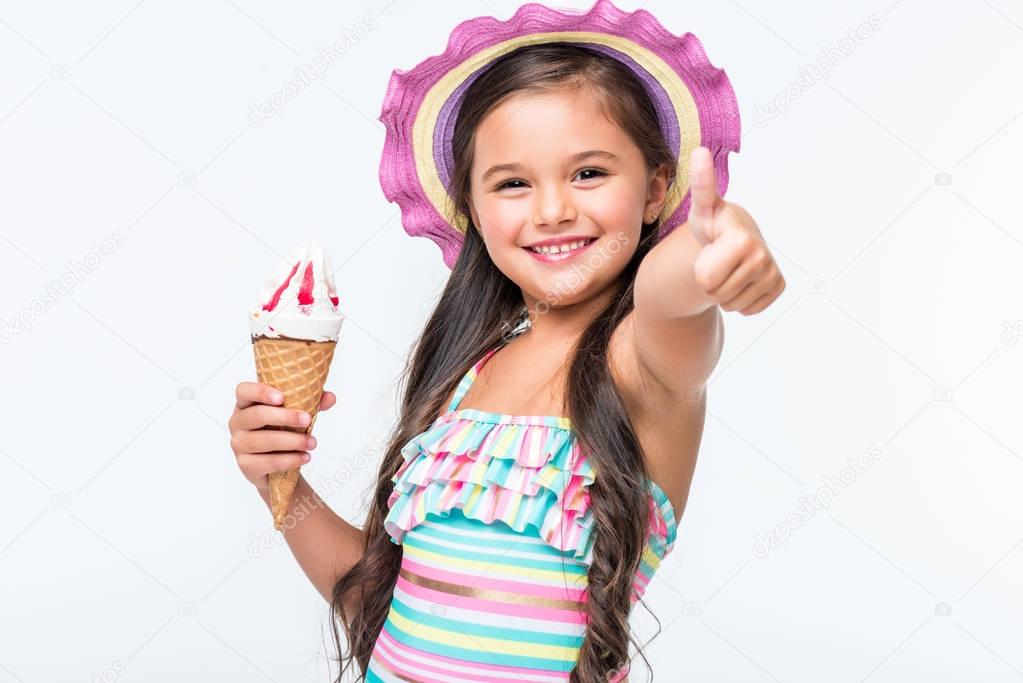 child in swimsuit with ice cream   