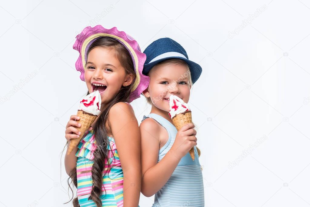 happy kids in swimwear with ice cream