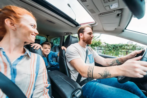Family riding on car together — Stock Photo, Image