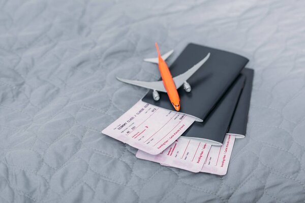 flight tickets with toy airplane