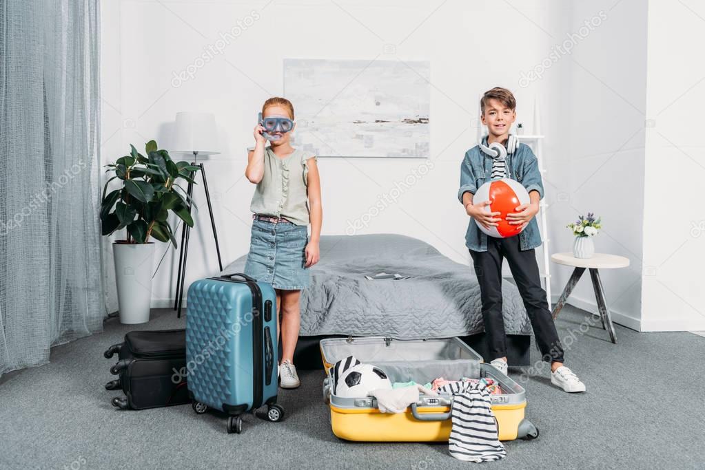kids packing clothes for trip