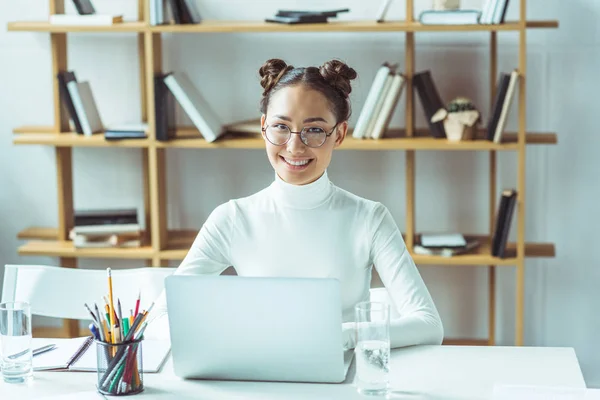 Asian student with laptop — Stock Photo, Image