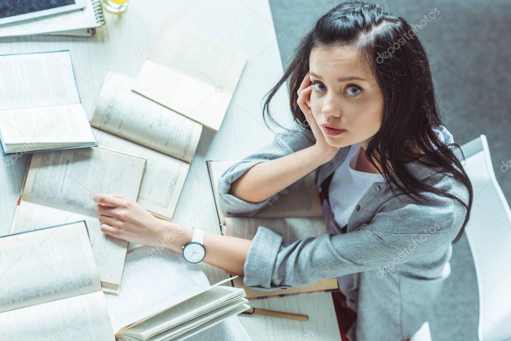 girl studying with books