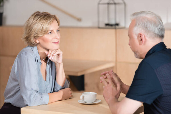 couple talking at cafe