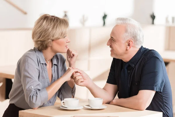 Happy couple holding by hands — Stock Photo, Image